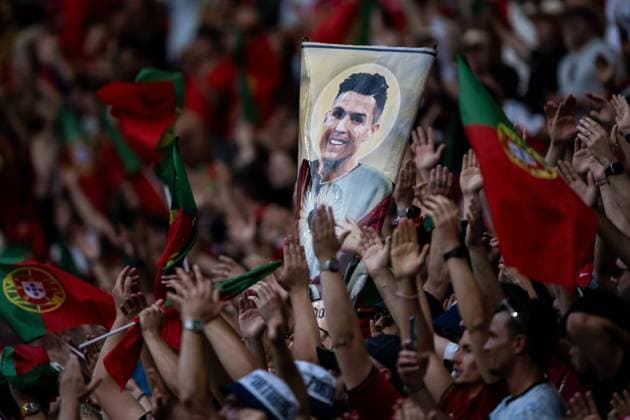 240618 Fans of Portugal with a sign depicting Cristiano Ronaldo of Portugal as a saint ahead of the UEFA Euro 2024 Football Championship match between Portugal and Czech Republic on June 18, 2024 in Leipzig Photo Mathias Bergeld BILDBYRAN kod MB MB0938 fotboll football soccer fotballs fotballs em europamästerskap em uefa euro uefa european football championship euro 2024 portugal tjeckien czech republic bbeng publik  Copyright: MATHIASxBERGELD BB240618MB195