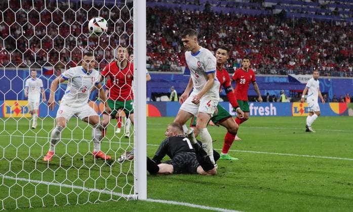 re Robin Hranac scores the own goal for 1 1 against goalkeeper Jindrich Stanek, behind him Tomas Holes and Cristiano Ronaldo Sport Football Soccer European Championship Euro 2024 European Championship Men Season 2023 2024 18 06 2024 Portugal POR vs Czech Republic CZE in Leipzig DFL regulations prohibit any use of photographs as image sequences and or quasi video