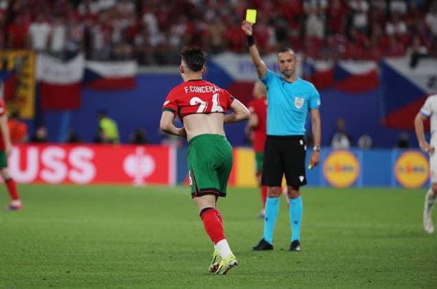 Referee Marco Guida ITA shows yellow card for Francisco Conceicao Cheers with shirt removal after 2 1 Joy Emotion Sport Football Soccer European Championship Euro 2024 European Championship Men Season 2023 2024 18 06 2024 Portugal POR vs Czech Republic CZE in Leipzig DFL regulations prohibit any use of photographs as image sequences and or quasi video