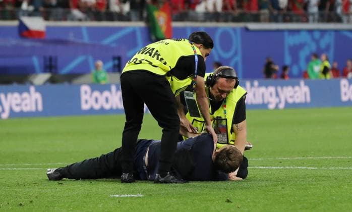 Stewards arrest a streaker after the end of the match Sport Football Soccer European Championship Euro 2024 European Championship Men Season 2023 2024 18 06 2024 Portugal POR vs Czech Republic CZE in Leipzig DFL regulations prohibit any use of photographs as image sequences and or quasi video