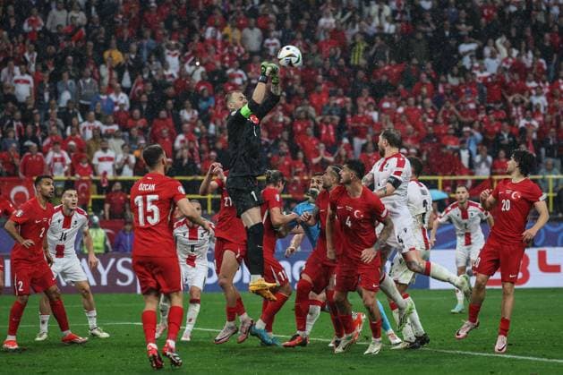 (240619) -- DORTMUND, June 19, 2024 -- Mert Gunok (Top) of Turkiye makes a save during the UEFA EURO, EM, Europameisterschaft,Fussball 2024 Group F match between Turkiye and Georgia in Dortmund, Germany on June 18, 2024. ) (SP)GERMANY-DORTMUND-FOOTBALL-EURO 2024-T?RKIYE VS GEORGIA PanxYulong 