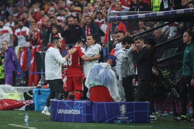(240619) -- DORTMUND, June 19, 2024 -- Vincenzo Montella (3rd L), head coach of Turkiye, hugs Arda Guler (2nd L) of Turkiye during the UEFA EURO, EM, Europameisterschaft,Fussball 2024 Group F match between Turkiye and Georgia in Dortmund, Germany on June 18, 2024. ) (SP)GERMANY-DORTMUND-FOOTBALL-EURO 2024-T?RKIYE VS GEORGIA PanxYulong 