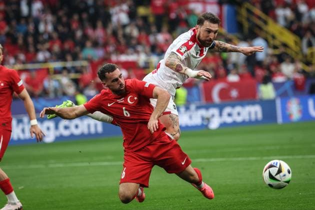 (240619) -- DORTMUND, June 19, 2024 -- Orkun Kokcu (L) of Turkiye vies with Guram Kashia of Georgia during the UEFA EURO, EM, Europameisterschaft,Fussball 2024 Group F match between Turkiye and Georgia in Dortmund, Germany on June 18, 2024. ) (SP)GERMANY-DORTMUND-FOOTBALL-EURO 2024-T?RKIYE VS GEORGIA PanxYulong 
