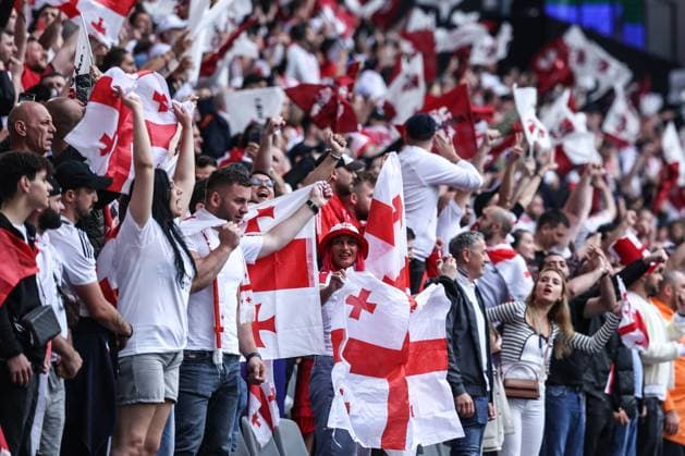 (240619) -- DORTMUND, June 19, 2024 -- Fans of team Georgia cheer in the stands during the UEFA EURO, EM, Europameisterschaft,Fussball 2024 Group F match between Turkiye and Georgia in Dortmund, Germany on June 18, 2024. ) (SP)GERMANY-DORTMUND-FOOTBALL-EURO 2024-T?RKIYE VS GEORGIA PanxYulong 
