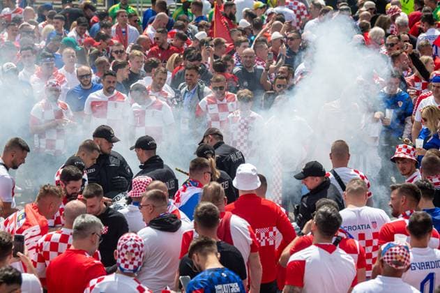 Football, men, season 2023 24, Euro 2024 Group B 2 matchday in Hamburg, Croatia Albania, Croatian fans celebrate with pyrotechnics outside the stadium, 19 06 2024, Copyright: xSebastianxRäppold MatthiasxKochx