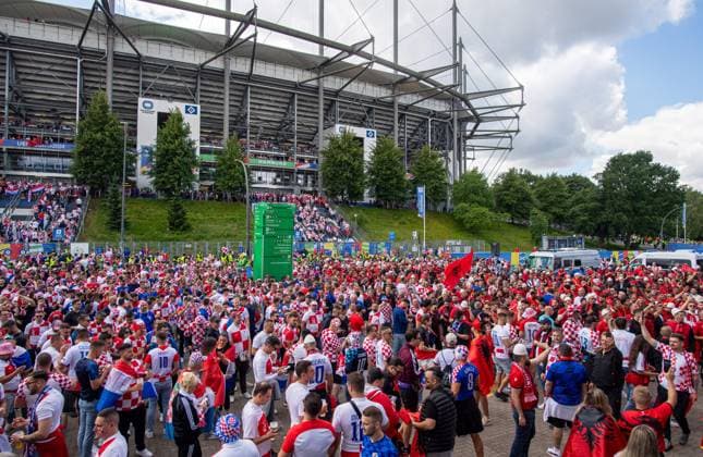 Football, men, season 2023 24, Euro 2024 Group B 2 matchday in Hamburg, Croatia Albania, Croatian and Albanian fans celebrate together in front of the stadium, 19 06 2024, Copyright: xSebastianxRäppold MatthiasxKochx
