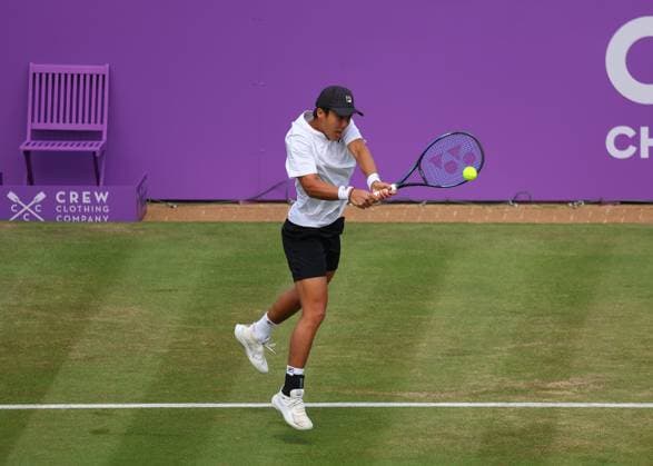 19th June 2024; Cinch Championships, Queens Club, West Kensington, London, England: Cinch Championships Queens Club, Day 3; Rinky Hijikata (AUS) with a backhand shot to Matteo Arnaldi (ITA), mens singles match  ActionPlus12656704 JohnxPatrickxFletcher