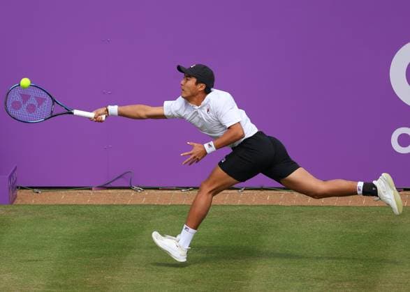 19th June 2024; Cinch Championships, Queens Club, West Kensington, London, England: Cinch Championships Queens Club, Day 3; Rinky Hijikata (AUS) with a forehand shot to Matteo Arnaldi (ITA), mens singles match  ActionPlus12656705 JohnxPatrickxFletcher
