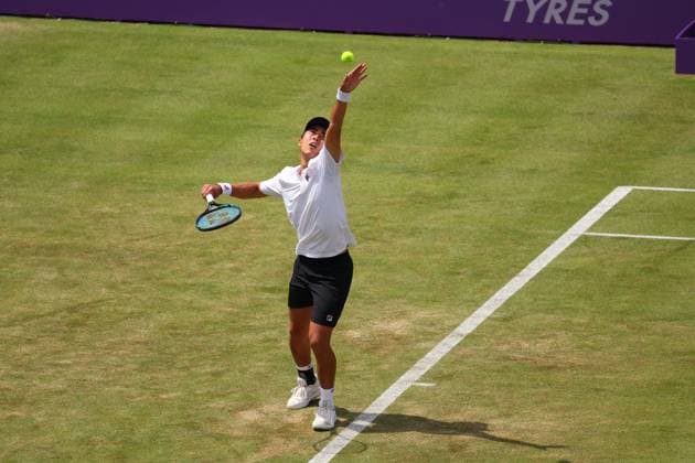 19th June 2024; Cinch Championships, Queens Club, West Kensington, London, England: Cinch Championships Queens Club, Day 3; Rinky Hijikata (AUS) serves to Matteo Arnaldi (ITA), mens singles match  ActionPlus12656718 JohnxPatrickxFletcher