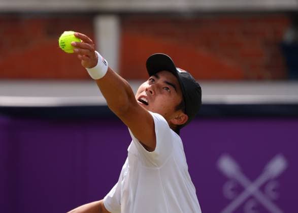 19th June 2024; Cinch Championships, Queens Club, West Kensington, London, England: Cinch Championships Queens Club, Day 3; Rinky Hijikata (AUS) serves to Matteo Arnaldi (ITA), mens singles match  ActionPlus12656788 JohnxPatrickxFletcher