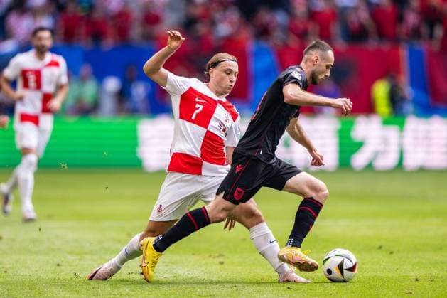 Croatia v Albania, UEFA EURO, EM, Europameisterschaft,Fussball 2024, Hamburg, Germany Hamburg, Germany. 19th, June 2024. Mario Mitaj (3) of Albania and Lovro Majer (7) of Croatia seen during the UEFA Euro 2024 match in Group B between Croatia and the Albania at Volksparkstadion in Hamburg. Hamburg Germany  Copyright: xGonzalesxPhoto FrederikkexJensenx