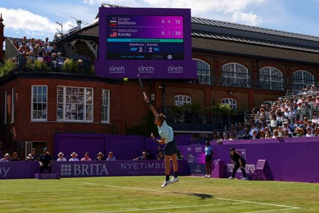19th June 2024; Cinch Championships, Queens Club, West Kensington, London, England: Cinch Championships Queens Club, Day 3; Sebastian Korda (USA) serves to Grigor Dimitrov (BUL) on Centre Court, mens singles match  ActionPlus12656818 JohnxPatrickxFletcher