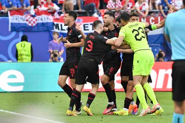 GER, Euro 2024, Group B, Croatia HRV vs Albania ALB 19 06 2024, Volksparkstadion, GER, Euro 2024, Group B, Croatia HRV vs Albania ALB in picture Klaus Gjasula ALB 08 shoots the goal to 2 2 for Albania past goalkeeper Dominik Livakovic HRV 01 and cheers with the team nordphotoxGmbH xWitke nph00002