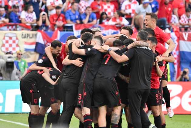 GER, Euro 2024, Group B, Croatia HRV vs Albania ALB 19 06 2024, Volksparkstadion, GER, Euro 2024, Group B, Croatia HRV vs Albania ALB in picture Klaus Gjasula ALB 08 shoots the goal to 2 2 for Albania past goalkeeper Dominik Livakovic HRV 01 and cheers with the team nordphotoxGmbH xWitke nph00002