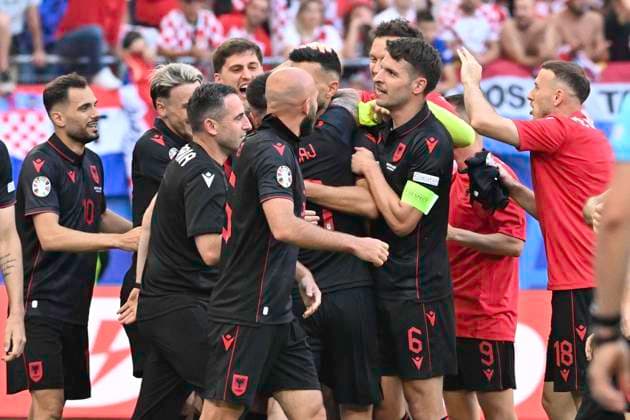 GER, Euro 2024, Group B, Croatia HRV vs Albania ALB 19 06 2024, Volksparkstadion, GER, Euro 2024, Group B, Croatia HRV vs Albania ALB in picture Klaus Gjasula ALB 08 shoots the goal to 2 2 for Albania past goalkeeper Dominik Livakovic HRV 01 and cheers with the team nordphotoxGmbH xWitke nph00002