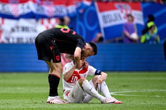 Croatia v Albania: Group B - UEFA EURO, EM, Europameisterschaft,Fussball 2024 HAMBURG, GERMANY - JUNE 19: Arber Hoxha of Albania consoles Luka Modric of Croatia after the UEFA EURO 2024 group stage match between Croatia and Albania at Volksparkstadion on June 19, 2024 in Hamburg, Germany. MarkoxLukunic PIXSELL