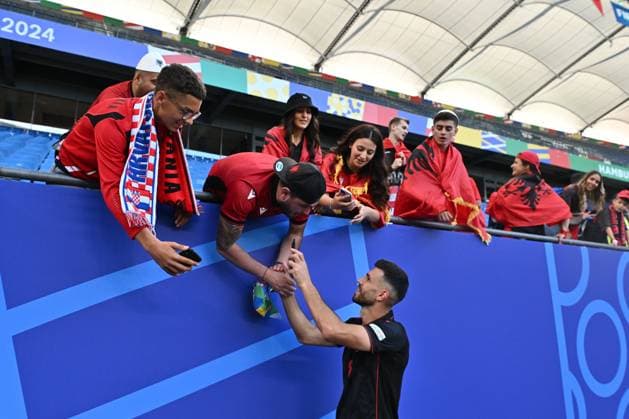 HAMBURG, GERMANY - JUNE 19: Klaus Gjasula of Albania takes selfies with fans after the UEFA EURO, EM, Europameisterschaft,Fussball 2024 group stage match between Croatia and Albania at Volksparkstadion on June 19, 2024 in Hamburg, Croatia v Albania: Group B - UEFA EURO 2024 Copyright: xSebastianxFrejx
