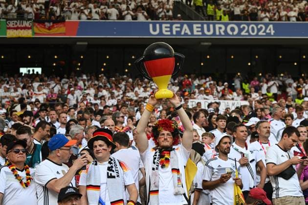 A German fan holds up a Euro Cup in the Fann look Football, Men, Season 2023 24, Euro 20204 Group A 2 Matchday in Stuttgart, Germany Hungary, v l , 19 06 2024, Copyright: xMatthiasxKochx