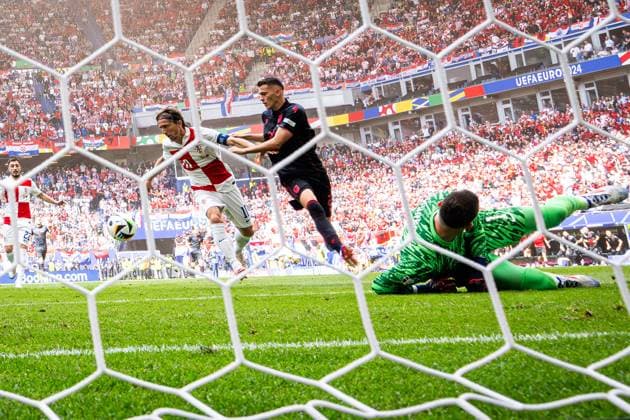 (240619) -- HAMBURG, June 19, 2024 -- Luka Modric (front L) of Croatia vies with Kristjan Asllani of Albania during the UEFA EURO, EM, Europameisterschaft,Fussball 2024 Group B match between Croatia and Albania in Hamburg, Germany on June 19, 2024. ) (SP)GERMANY-HAMBURG-FOOTBALL-EURO 2024-CROATIA VS ALBANIA XiaoxYijiu 