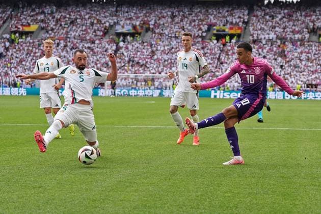 19 06 2024, Football UEFA EURO 2024, preliminary round, match day 2, Germany Hungary, in the Stuttgart Arena v l Attila Fiola Hungary and Jamal Musiala Germany
