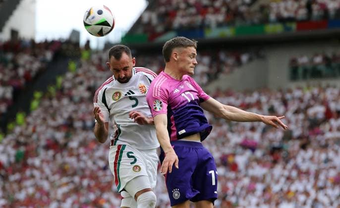 Attila Fiola in a duel with Florian Wirtz Sport Football Soccer European Championship Euro 2024 European Championship Men Season 2023 2024 19 06 2024 Germany GER vs Hungary HUN in Stuttgart DFL regulations prohibit any use of photographs as image sequences and or quasi video