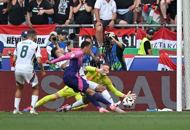 19 06 2024, Football UEFA EURO 2024, Preliminary round, Matchday 2, Germany Hungary, at Stuttgart Arena Jamal Musiala Germany scores to make it 1-0 against goalkeeper Peter Gulacsi Hungary