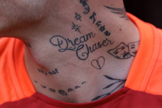 Cologne, Germany, 15th June 2024. Tattoos on the neck of Hungary substitutes prior to the UEFA European Championships match at Cologne Stadium, Cologne. Picture credit should read: Jonathan Moscrop Sportimage EDITORIAL USE ONLY. No use with unauthorised audio, video, data, fixture lists, club league logos or live services. Online in-match use limited to 120 images, no video emulation. No use in betting, games or single club league player publications. SPI-3181-0074