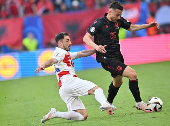 (240619) -- HAMBURG, June 19, 2024 -- Josip Juranovic (L) of Croatia vies with Arber Hoxha of Albania during the UEFA EURO, EM, Europameisterschaft,Fussball 2024 Group B match between Croatia and Albania in Hamburg, Germany on June 19, 2024. ) (SP)GERMANY-HAMBURG-FOOTBALL-EURO 2024-CROATIA VS ALBANIA RenxPengfei 