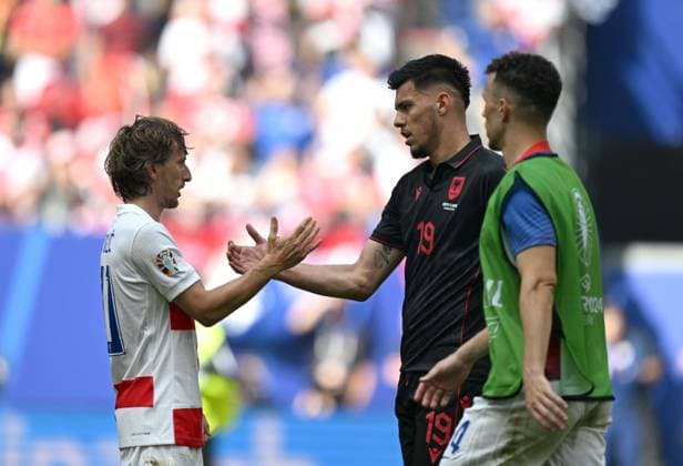 (240619) -- HAMBURG, June 19, 2024 -- Luka Modric (L) of Croatia greets Mirlind Daku (C) of Albania after the UEFA EURO, EM, Europameisterschaft,Fussball 2024 Group B match between Croatia and Albania in Hamburg, Germany on June 19, 2024. ) (SP)GERMANY-HAMBURG-FOOTBALL-EURO 2024-CROATIA VS ALBANIA XiaoxYijiu 
