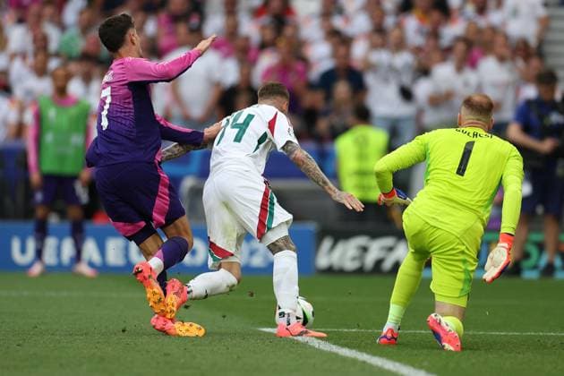 Stuttgart, Arena Stuttgart Wednesday, June 19, 2024 UEFA EURO 2024 Germany, Group A stage Matchday 2 Group A Germany Hungary,Kai Havertz Germany , Bendeguz Bolla Hungary , goalkeeper, goalkeeper Peter Gulacsi Hungary duel, action, action, battles for the ball in the penalty area Copyright: JoaquimxFerreira