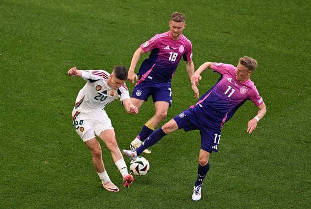 19 06 2024, xjhx, European Football Championship 2024, Germany Hungary emspor, v l Roland Sallai Hungary , Maximilian Mittelstädt German National Football Team DFB , Chris Führich German National Football Team DFB UEFA REGULATIONS PROHIBIT ANY USE OF PHOTOGRAPHS as IMAGE SEQUENCES and or QUASI VIDEO Stuttgart