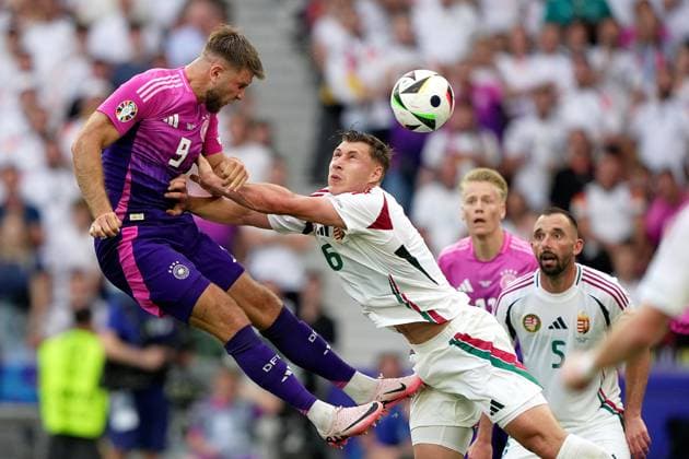 Germany s Niclas Fuellkrug fight for the ball with Hungary s Willi Orban during the Euro 2024 soccer match between Germany and Hungary at the Stuttgart Arena , Stuttgart , Germany - Wednesday 19 June 2024. - Soccer .  Copyright: xSpada LaPressex