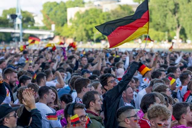 Fanzone Fan Mile Frankfurt am Main, 19 06 2024 Fans celebrate after a goal for Germany and wave flags, flag, Fanzone Fan Mile Frankfurt, Frankfurt am Main, Fanzone Fan Mile, 19 6 2024 Copyright: xBEAUTIFULxSPORTS Gawlikx