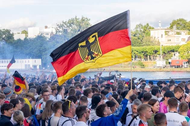 Fanzone Fan Mile Frankfurt am Main, 19 06 2024 Fans celebrate after a goal for Germany and wave flags, flag, Fanzone Fan Mile Frankfurt, Frankfurt am Main, Fanzone Fan Mile, 19 6 2024 Copyright: xBEAUTIFULxSPORTS Gawlikx