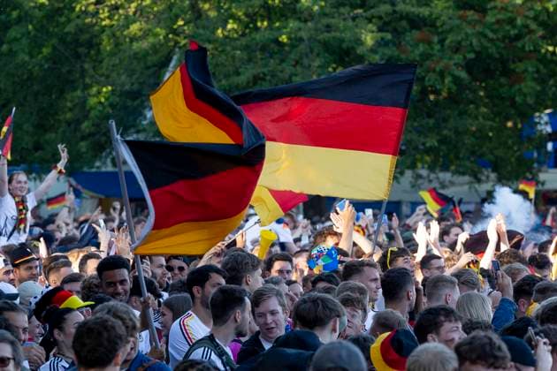 Fanzone Fan Mile Frankfurt am Main, 19 06 2024 Fans celebrate after a goal for Germany and wave flags, flag, Fanzone Fan Mile Frankfurt, Frankfurt am Main, Fanzone Fan Mile, 19 6 2024 Copyright: xBEAUTIFULxSPORTS Gawlikx