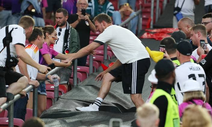 Coach Julian Nagelsmann climbs to his girlfriend Lena Wurzenberger Sport Football Soccer European Championship Euro 2024 European Championship Men Season 2023 2024 19 06 2024 Germany GER vs Hungary HUN in Stuttgart DFL regulations prohibit any use of photographs as image sequences and or quasi video