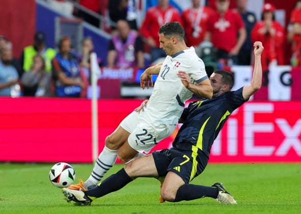 Scotland v Switzerland UEFA EURO, EM, Europameisterschaft,Fussball 2024 Group A John McGinn of Scotland tackles Xherdan Shaqiri of Switzerland during the UEFA Euro 2024 Group A match between Scotland and Switzerland at RheinEnergieStadion, Cologne Copyright: xPaulxChestertonx FIL-20271-0084 UK Newspapers OUT