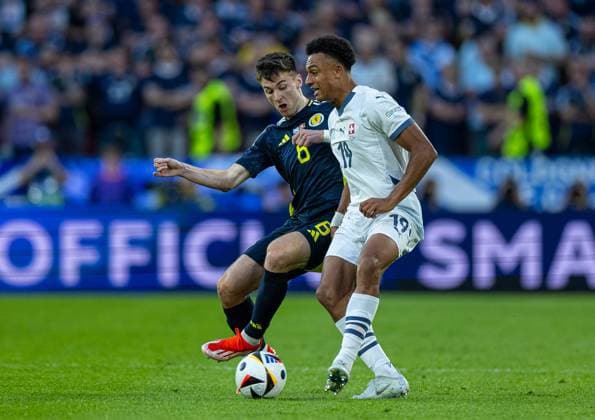 Football - UEFA EURO, EM, Europameisterschaft,Fussball 2024 - Group A - Scotland v Switzerland COLOGNE, GERMANY - Wednesday, June 19, 2024: Switzerland s Dan Ndoye (R) is challenged by Scotland s Kieran Tierney during the UEFA Euro 2024 Group A match between Scotland and Switzerland at the Müngersdorfer Stadium. (Photo by David Rawcliffe Propaganda) COLOGNE Müngersdorfer Stadium NORTH RHINE-WESTPHALIA GERMANY  Copyright: xDavidxRawcliffex P2024-06-19-Scotland_Switzerland-27