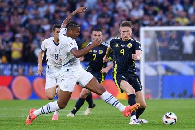 Soccer UEFA EURO 2024 Group Stage 2 Matchday Scotland Switzerland on 19 06 2024 at Köln Stadion in Cologne Manuel Akanji Switzerland , left Scott McTominay Scotland , right xRx