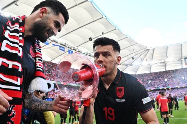 HAMBURG, GERMANY - JUNE 19: Elseid Hysaj and Mirlind Daku of Albania celebrate with a megaphone after the UEFA EURO, EM, Europameisterschaft,Fussball 2024 group stage match between Croatia and Albania at Volksparkstadion on June 19, 2024 in Hamburg, G Croatia v Albania: Group B - UEFA EURO 2024 Copyright: xSebastianxFrejx