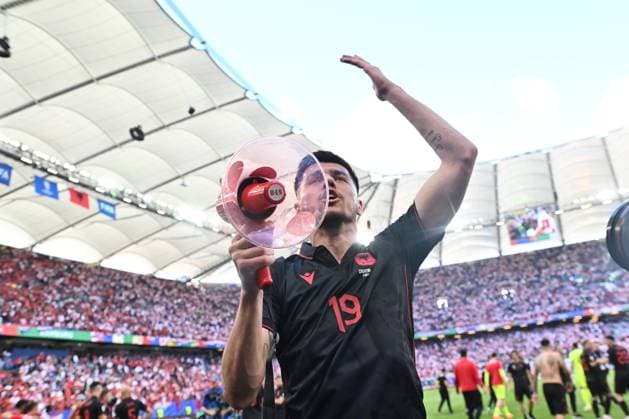 HAMBURG, GERMANY - JUNE 19: Mirlind Daku of Albania celebrates with a megaphone after the UEFA EURO, EM, Europameisterschaft,Fussball 2024 group stage match between Croatia and Albania at Volksparkstadion on June 19, 2024 in Hamburg, Croatia v Albania: Group B - UEFA EURO 2024 Copyright: xSebastianxFrejx