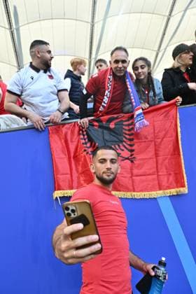 HAMBURG, GERMANY - JUNE 19: Naser Aliji of Albania takes selfies with fans after the UEFA EURO, EM, Europameisterschaft,Fussball 2024 group stage match between Croatia and Albania at Volksparkstadion on June 19, 2024 in Hamburg, Croatia v Albania: Group B - UEFA EURO 2024 Copyright: xSebastianxFrejx