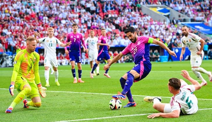 Ilkay Guendogan Germany prepares his teams first goal, UEFA EURO 2024 Group A, Germany vs Hungary, Arena Stuttgart on June 19, 2024 in Stuttgart, Germany Photo by Silas Schueller DeFodi Images Ilkay Guendogan Germany controls the ball against goalkeeper Peter Gulacsi Hungary and Willi Orban Hungary to assist for the first goal, UEFA EURO 2024 Group A, Germany vs Hungary, Arena Stuttgart on June 19, 2024 in Stuttgart, Germany Photo by Silas Schueller DeFodi Images Defodi 0583388603st Defodi-738