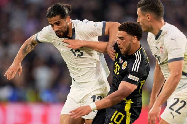 Switzerland s Ricardo Rodriguez fights for the ball with Scotland s Che Adams during the Euro 2024 soccer match between Scotland and Swiss at the RheinEnergie Stadion, Cologne, Germany - Wednesday 19 , June , 2024. - Soccer .  Copyright: xFabioxFerrari LaPressex