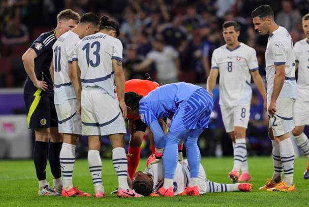 Scotland v Switzerland UEFA EURO, EM, Europameisterschaft,Fussball 2024 Group A Manuel Akanji of Switzerland is checked on by his team-mates after falling during the UEFA Euro 2024 Group A match between Scotland and Switzerland at RheinEnergieStadion, Cologne Copyright: xPaulxChestertonx FIL-20271-0152 UK Newspapers OUT