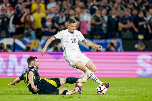 Cologne, Germany, June 19th 2024: Michel Aebischer (20 Switzerland) gets tackled during the UEFA EURO, EM, Europameisterschaft,Fussball 2024 Germany Group A football match between Scotland and Switzerland at Cologne Stadium in Cologne, Germany. (Daniela Porcelli SPP) Copyright: xDanielaxPorcellix xSPPx spp-en-DaPoSp-20240619-_DP12270