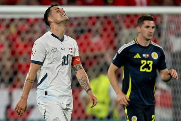 240619 EURO2024 SCOTLAND VS SWITZERLAND Granit Xhaka (10) of Switzerland reacts during a soccer game between the national teams of Scotland and Switzerland on the 2nd matchday in Group A in the group stage of the UEFA EURO, EM, Europameisterschaft,Fussball 2024 tournament , on Wednesday 19 June 2024 in Cologne , Germany . PHOTO SPORTPIX David Catry Cologne GERMANY  Copyright: xx 465158