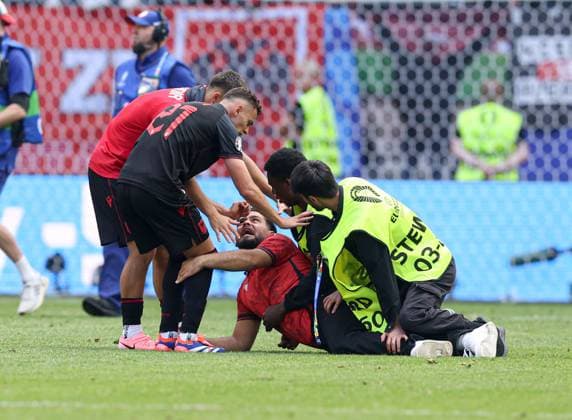 Stewards try to stop a pitch invader as Kristjan Asllani of Albania tries to intervene Croatia v Albania, UEFA European Championship, EM, Europameisterschaft 2024, Group B, Football, Volksparkstadion, Hamburg, Germany, 19 Jun 2024 EDITORIAL USE ONLY No use with unauthorised audio, video, data, fixture lists, club league logos or live services. Online in-match use limited to 120 images, no video emulation. No use in betting, games or single club league player publications. Copyright: xPaulxCurrie Shutterstockx 14543648gc