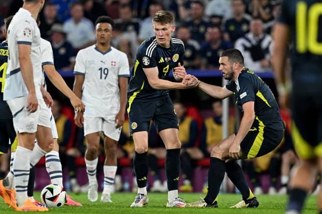 240619 EURO2024 SCOTLAND VS SWITZERLAND Scott McTominay (4) of Scotland and John McGinn (7) of Scotland pictured during a soccer game between the national teams of Scotland and Switzerland on the 2nd matchday in Group A in the group stage of the UEFA EURO, EM, Europameisterschaft,Fussball 2024 tournament , on Wednesday 19 June 2024 in Cologne , Germany . PHOTO SPORTPIX David Catry Cologne GERMANY  Copyright: xx 465178