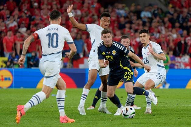 Colony, Germany: Kenny McLean of Scotland in action against Ruben Vargas of Swiss and Fabian Rieder of Swiss during UEFA EURO, EM, Europameisterschaft,Fussball 2024 - Scotland vs Switzerland, UEFA European Football Championship in Colony, Germany, June 19 2024 UEFA European Football Championship - UEFA Euro 2024 - Scotland vs Switzerland  - ZUMAp169 20240619_zsa_p169_189 Copyright: xEmmanuelexMastrodonato IPAxSportx
